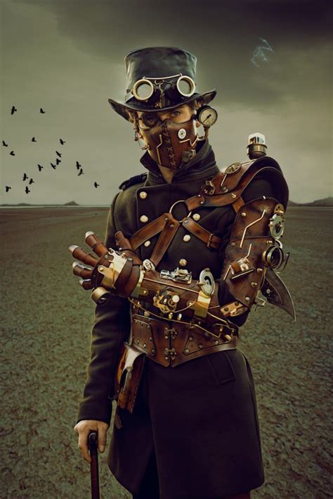 Steampunk Man With Leather Mask And Mechanical Arm For Costume