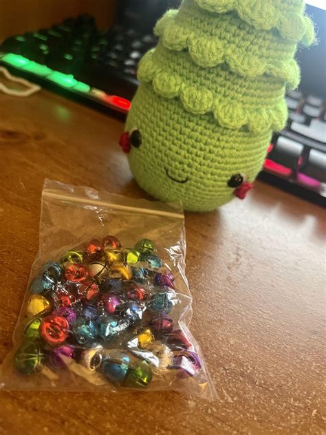 Please help me with stitching these tiny bells to my Christmas tree