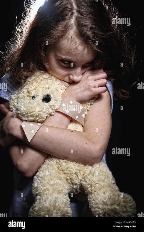 Sad And Depressed Girl Is Holding A Teddy Bear Stock Photo Alamy