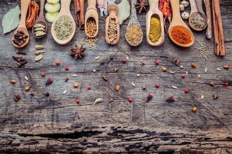 Premium Photo Various Of Spices And Herbs In Wooden Spoons On Shabby