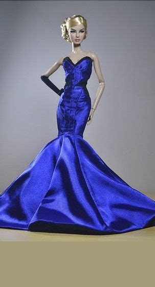 A Barbie Doll Wearing A Blue Dress