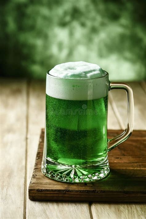 Mug With Dyed Green Beer And Three Leaved Shamrock For Saint Pa Stock