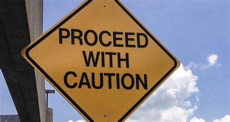 Proceed With Caution Road Sign