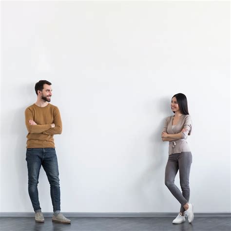 Free Photo Positive Adult Male And Woman Looking At Each Other