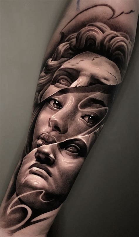 A Man S Arm With Tattoos On It And An Image Of His Face In The Middle