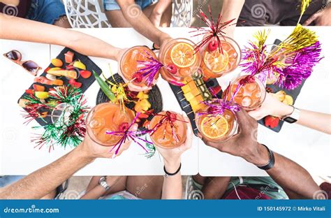 Friends Hands Toasting Summer Drinks At Cocktail Bar On Happy Hour