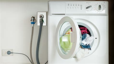 Hide Unsightly Washing Machine Hookups With A Rustic Wooden Diy