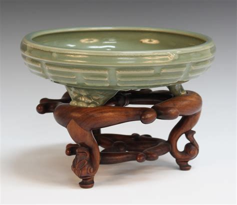 A Chinese Longquan Type Celadon Glazed Eight Trigrams Tripod Censer