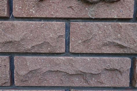 Closeup Of Brown Brick Veneer Wall With Black Mortar Joints Stock Photo