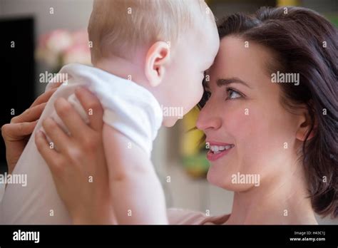 Caucasian Mother Touching Foreheads With Baby Son Stock Photo Alamy