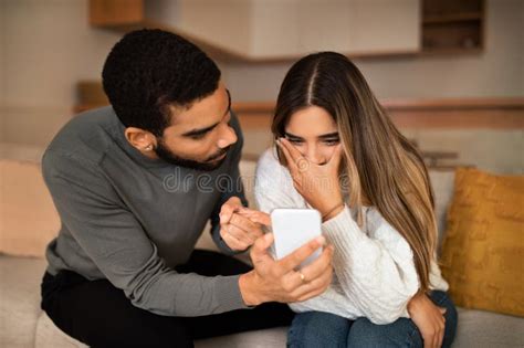 Angry Millennial Middle Eastern Husband Showing Smartphone To