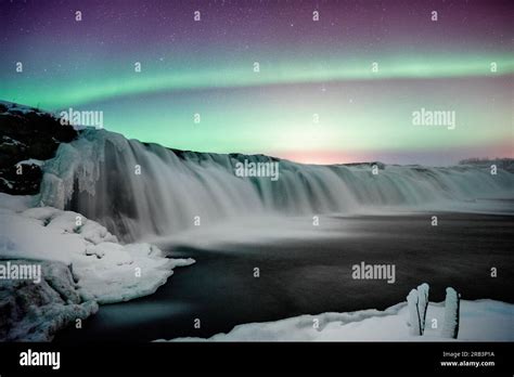 Green glow of the northern lights in Iceland Stock Photo - Alamy