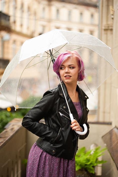 Premium Photo Cheerful Pretty Girl Holding Umbrella While Strolling