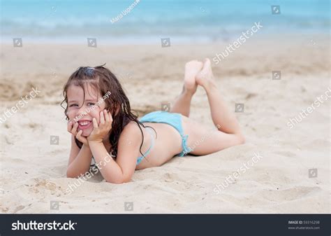 Smiling Little Girl Lying On Beach Stock Photo 59316298 | Shutterstock