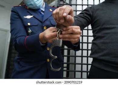 Police Officer Handcuffs Suspect Stock Photo 2090701219 | Shutterstock