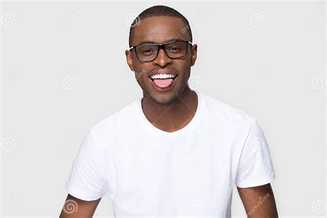 Funny Smiling African American Man In Glasses Showing Tongue Stock