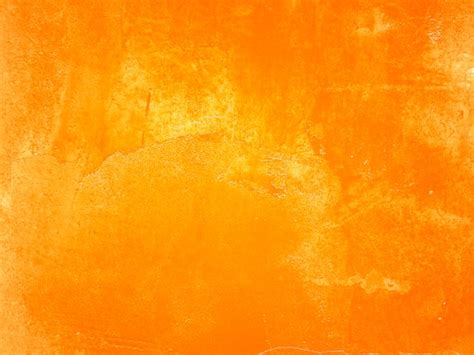 Free Photo | Orange wall with cracks and peeling paint.