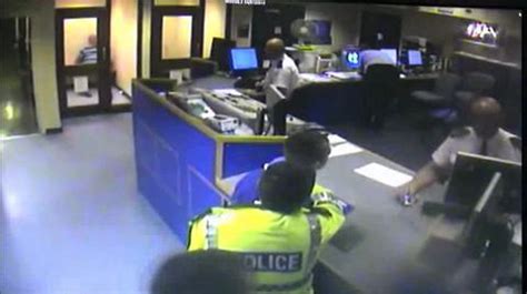 Watch Moment Merseyside Police Officer Forces Handcuffed Mans Face Onto Custody Desk