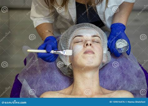 Beautician Makes Facial Massage To A Woman Stock Photo Image Of