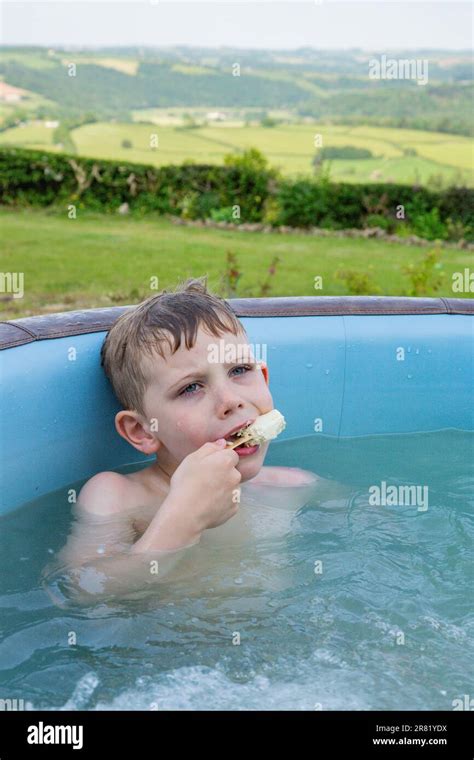 Six Year Old Boy In A Hot Tub High Bickington Devon England United Kingdom Stock Photo Alamy