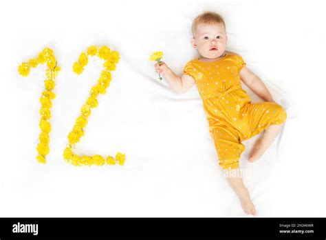 12-month-old baby girl. Baby milestone two months. Twelve month old baby Stock Photo - Alamy