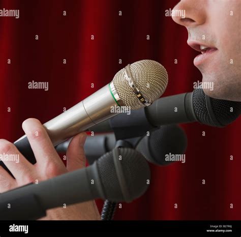 Man Speaking Into Microphone Stock Photo Alamy