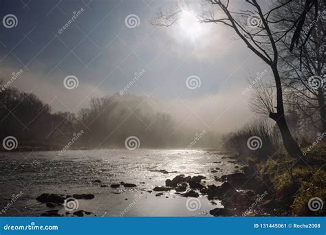 Morning Sun And Fog Hovering Over A Mountain River Stock Image Image