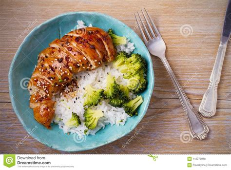 Glased Chicken Breast Rice And Broccoli As Garnish Chicken In