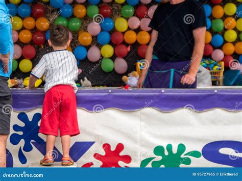 Boy Playing Darts Carnival Game Stock Image - Image of amusement, carnival: 95727965