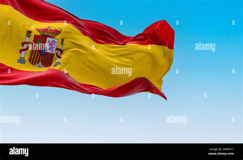 The National Flag Of Spain Waving In The Wind In A Clear Day European