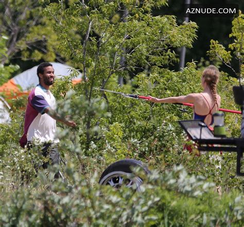 Mackenzie Davis Sexy Holds A Tree Pruner Saw Blade On Set Filming In Toronto Aznude