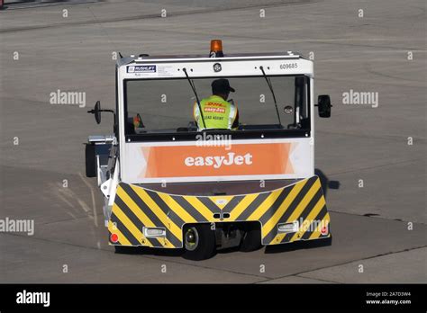 EASYJET / DHL PUSHBACK TUG AT GATWICK AIRPORT Stock Photo - Alamy