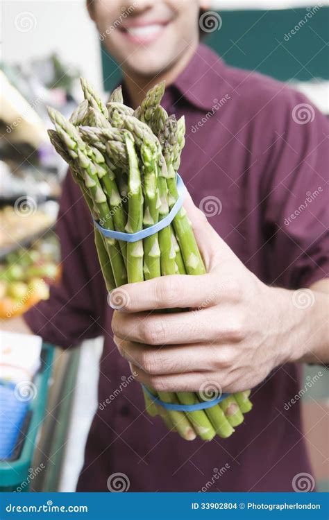 Midsection Man With Asparagus In Supermarket Stock Photo Image Of