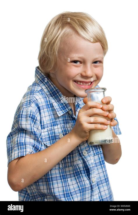 Happy Cute Boy Giggling And Holding A Bottle Of Milk To His Mouth