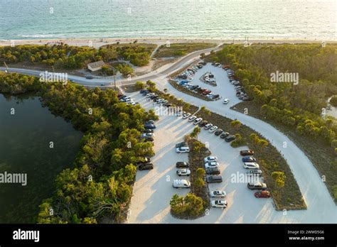 Vehicle parking area with cars parked on ocean beach parking lot at ...