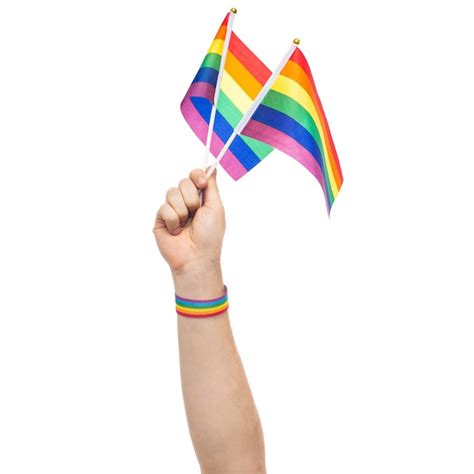 Premium Photo Hand With Gay Pride Rainbow Flags And Wristband