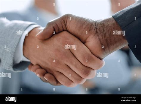 Business Handshake Two Businessman Shaking Hands In Office Stock Photo