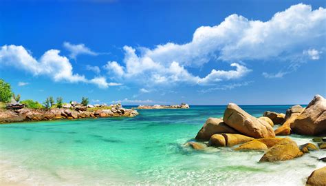 4K Tropics Sky Sea Stones Scenery Palms Clouds HD Wallpaper