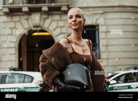 Leonie Hanne Wears Brown Dress Black Corset Gloves Teddy Coat Seen