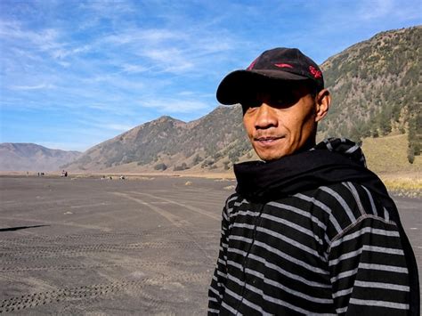 Premium Photo Portrait Of Man Wearing Cap While Standing On Land