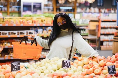 Premium Photo African Woman Wearing Disposable Medical Mask Shopping