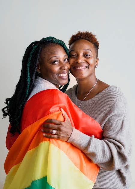 Premium Photo Happy Lesbian Couple With A Colorful Flag