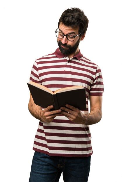 Premium Photo | Man with glasses reading a book