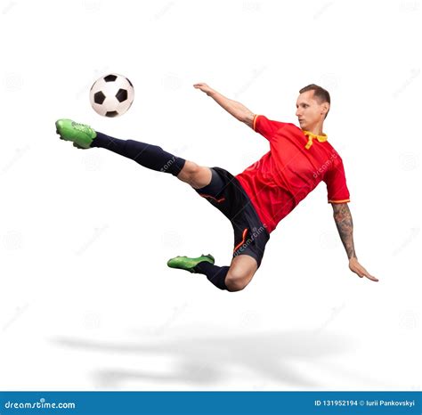 Soccer Player Kicking The Ball In The Air Isolated On White Stock Photo