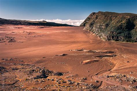 An Arid Area With Rocks And Dirt In The Foreground