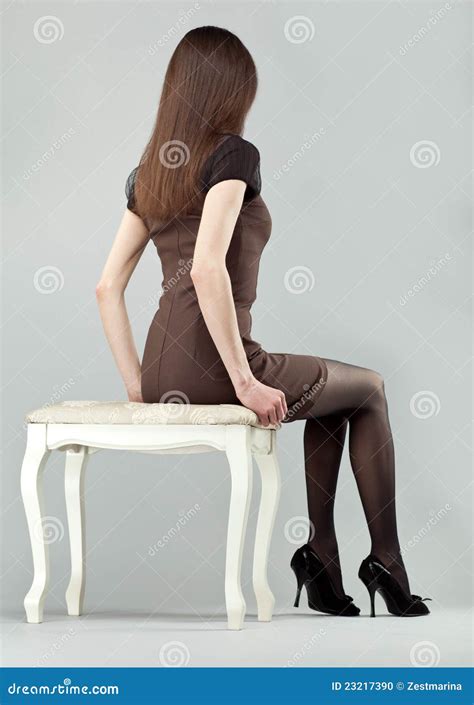 Elegant Brunette Girl Sitting On A Chair Stock Photo Image Of Caucasian Hair