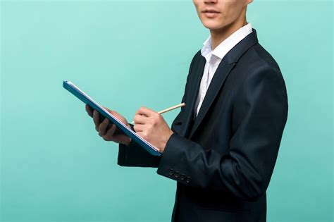 Premium Photo | A young professional carrying a clipboard