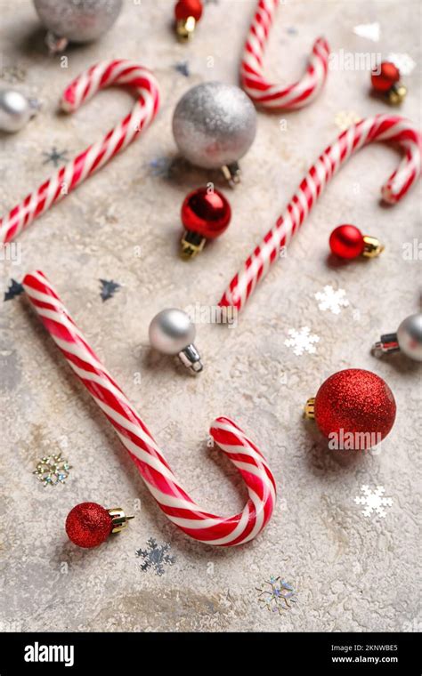 Composition With Sweet Candy Canes And Beautiful Christmas Balls On