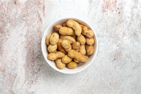 top view fresh peanuts  plate  white background peanut nut