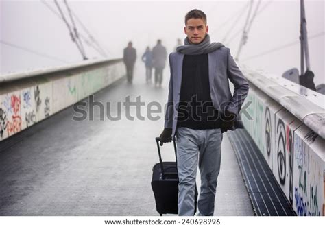 Trendy Handsome Man Walking Across Bridge Stock Photo 240628996